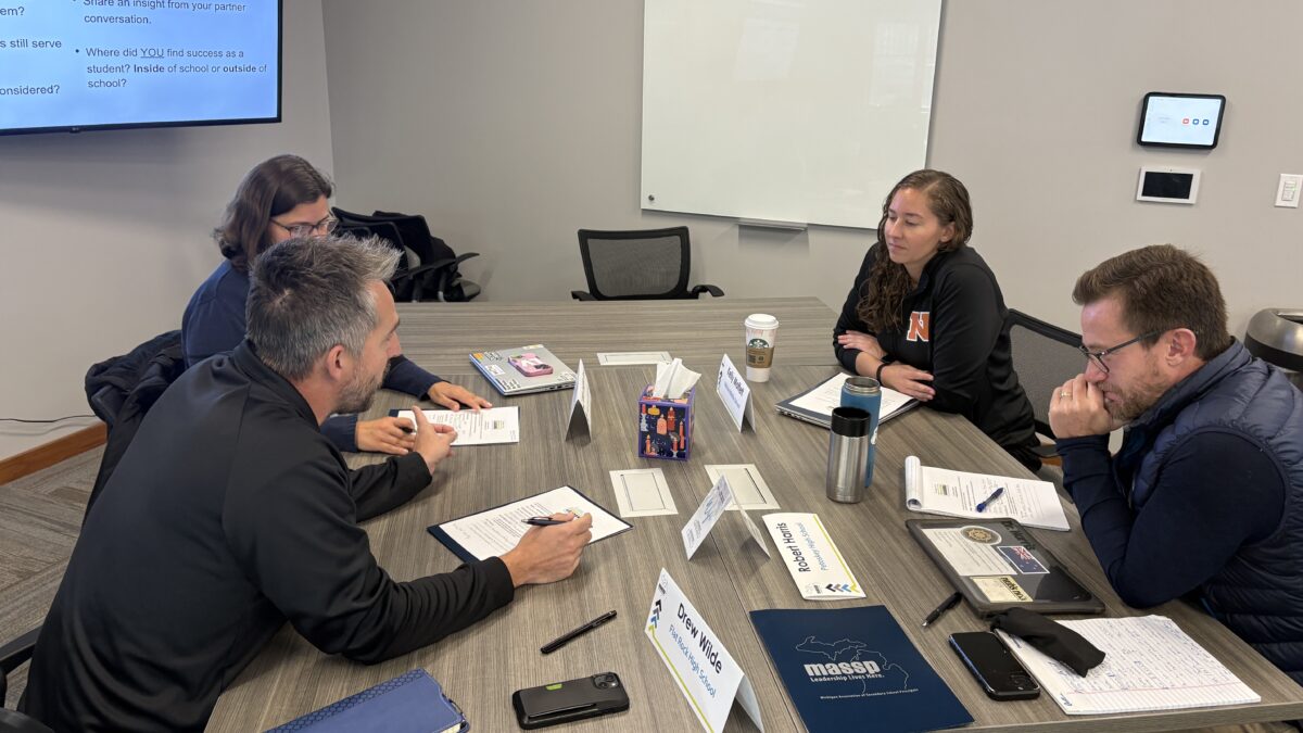 a group of ILN participants discuss a question at a table