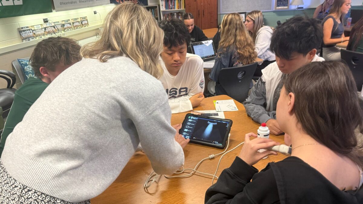 Forest Hills Central students participate in a hands-on classroom activity during a school visit.