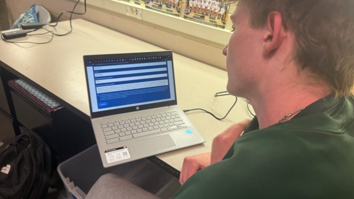 A Forest Hills Central student works on a laptop during a classroom activity.