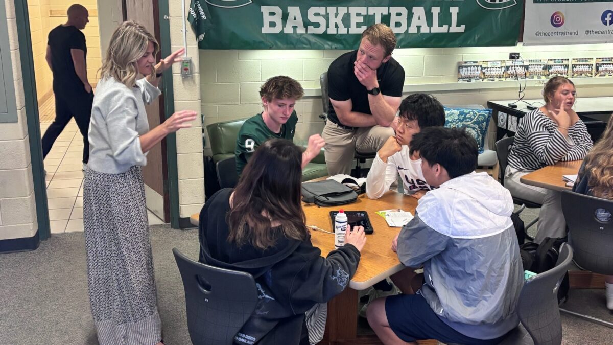 Students and educators work together during a classroom activity at Forest Hills Central High School.