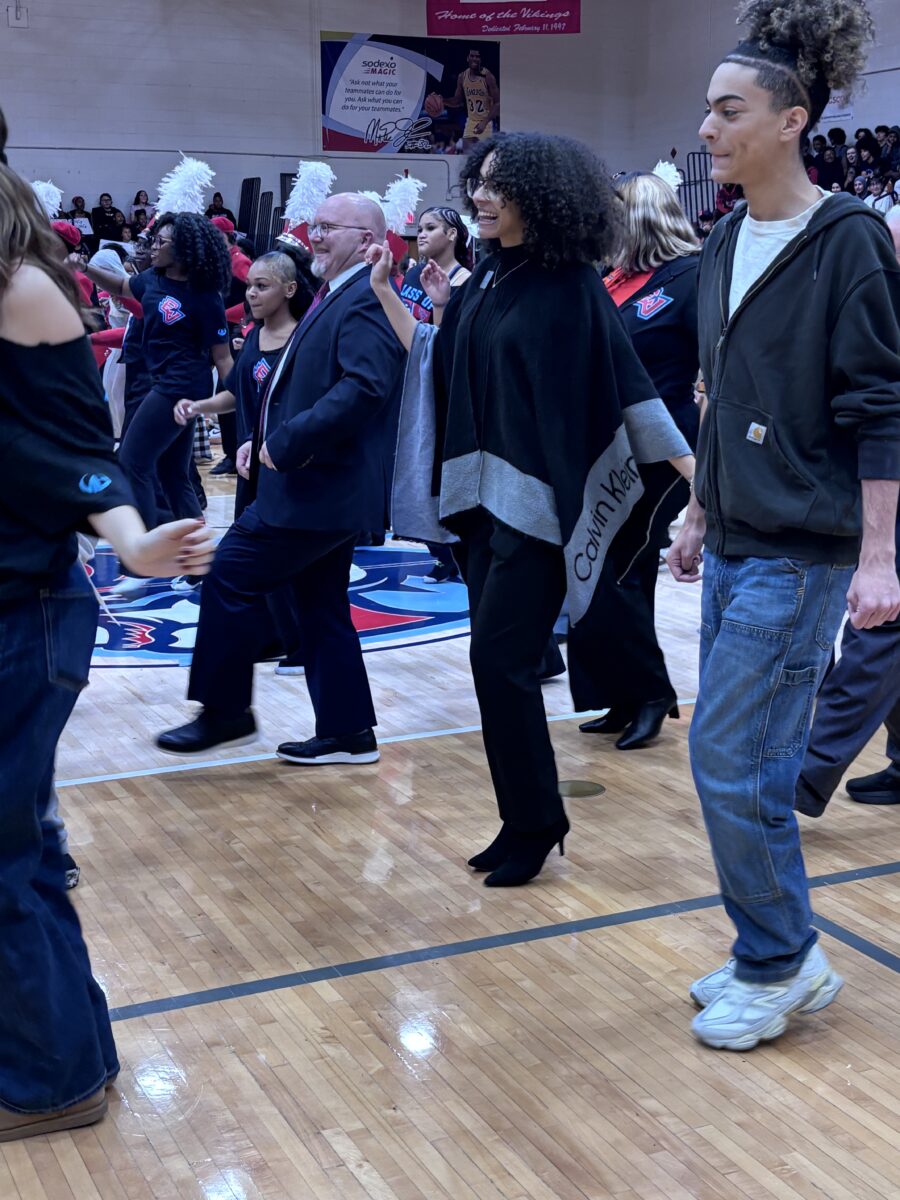 Colin Ripmaster, Lansing SD Board of Trustee member and students join the celebration with the cupid shuffle.