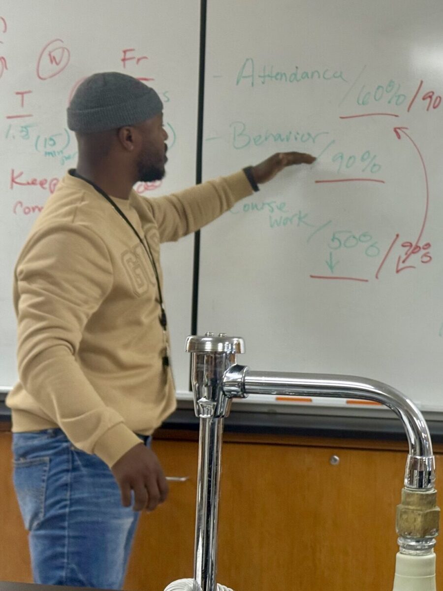 Virtual teacher pointing at whiteboard