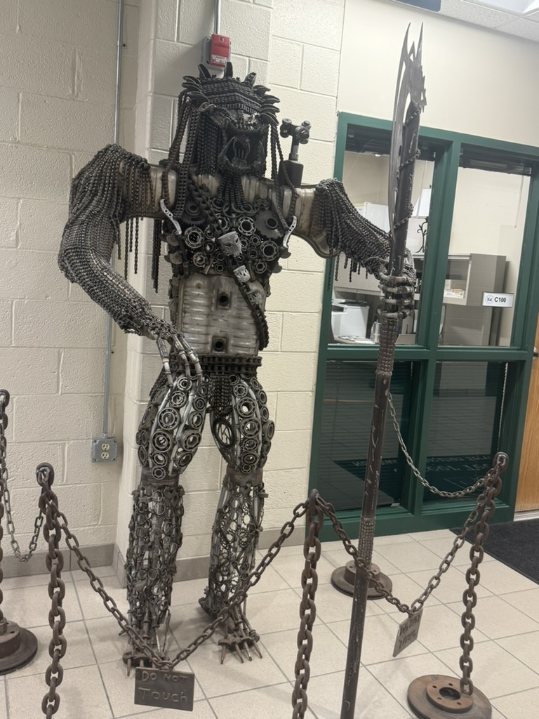 Industrial art piece of a full size metal warrior